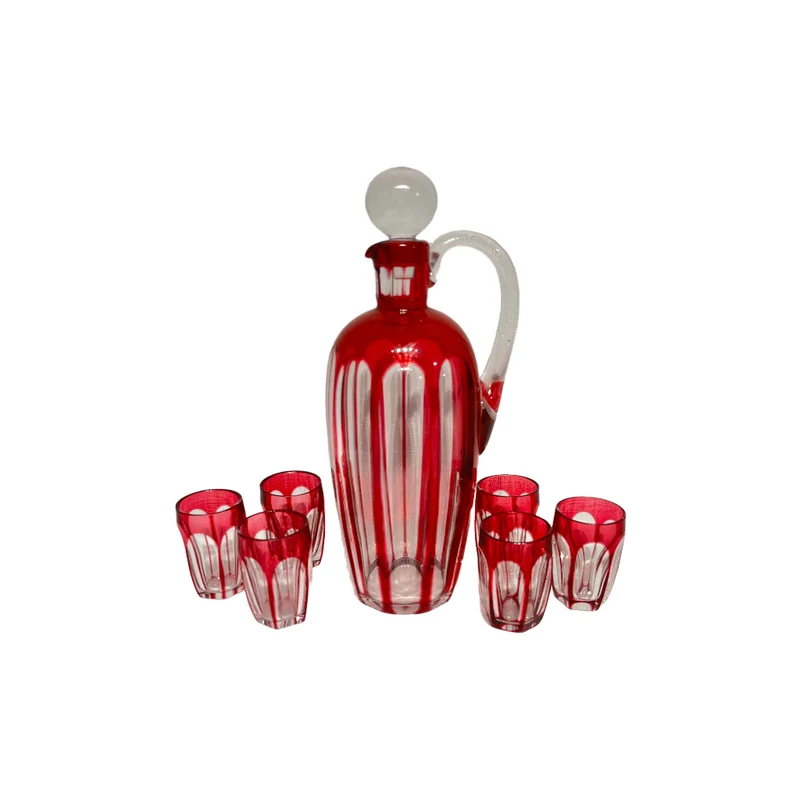 Conjunto de licorera y seis vasitos bordeaux de Cristal Nancy (1921-1934)
