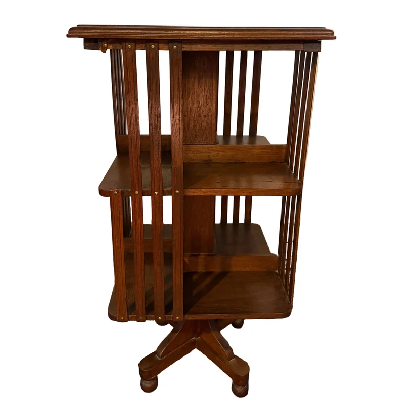 Librero giratorio Inglés en madera de nogal años 30