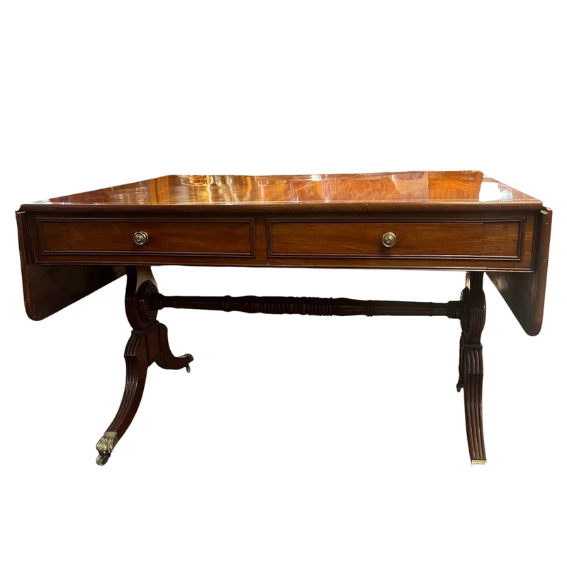 Mesa inglesa con alas laterales estilo Regencia, madera caoba rubia y bronce