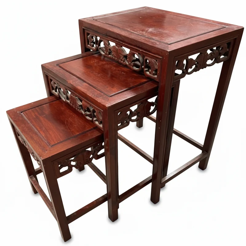 Three nesting French tables carved in an Asian style