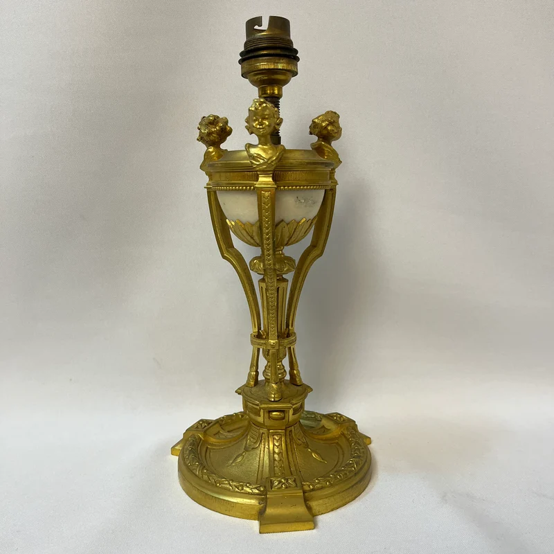 Gilt bronze lamp base and pair of black marble candlesticks, late 19th century