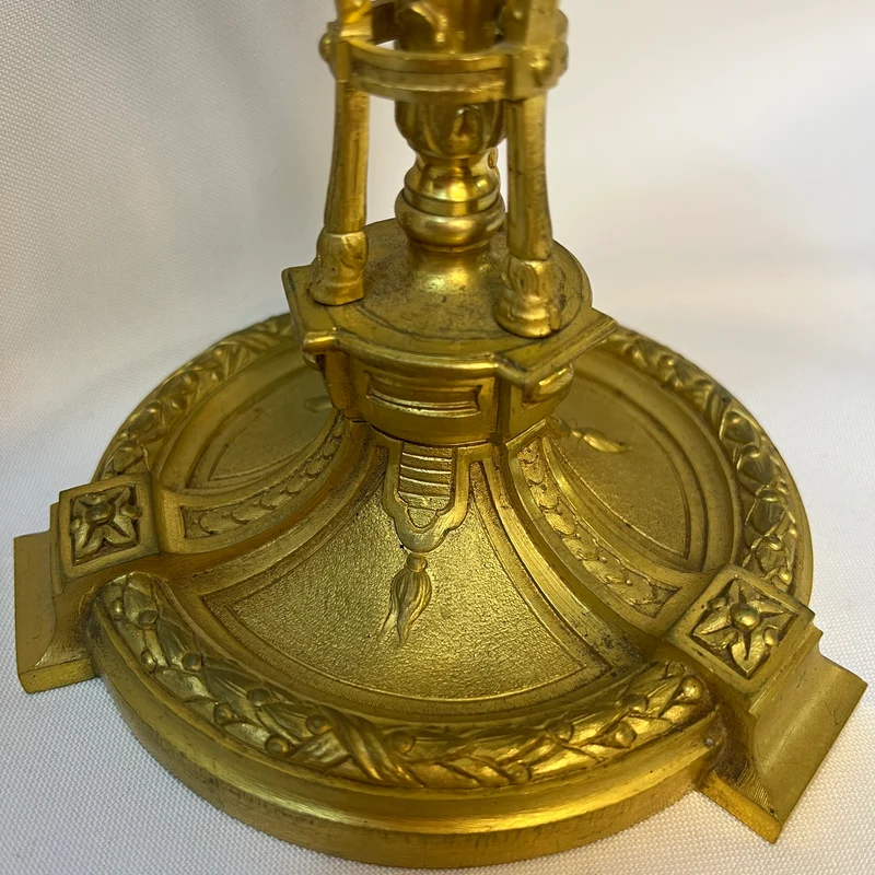 Gilt bronze lamp base and pair of black marble candlesticks, late 19th century