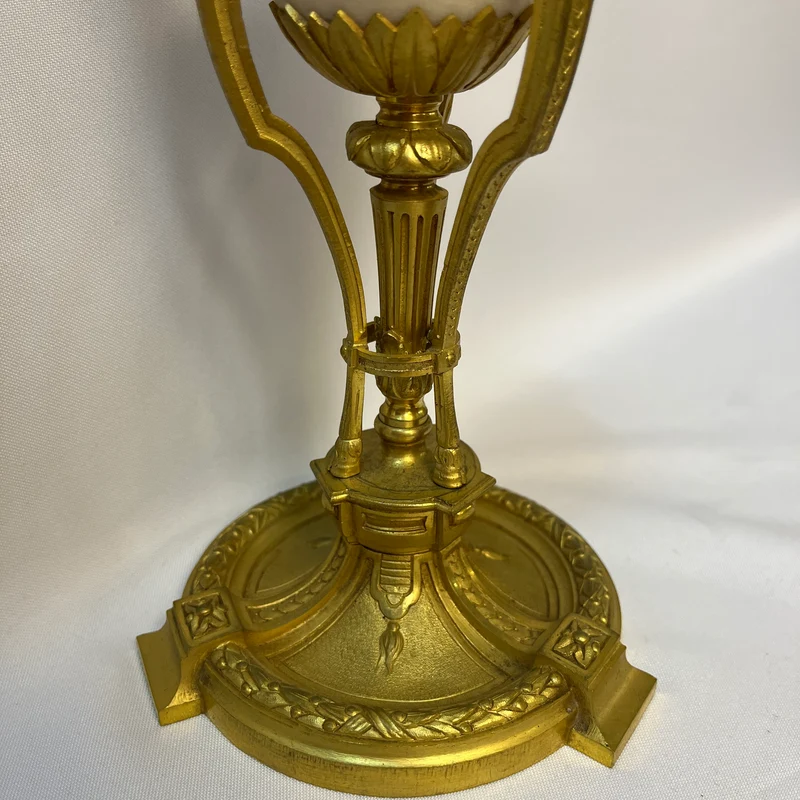 Gilt bronze lamp base and pair of black marble candlesticks, late 19th century