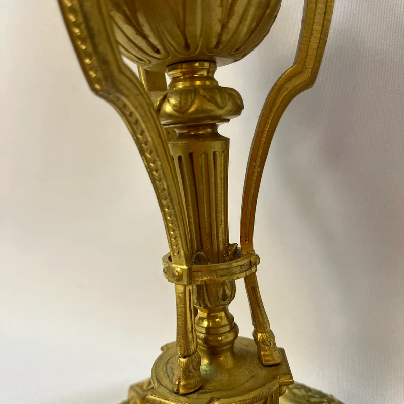 Gilt bronze lamp base and pair of black marble candlesticks, late 19th century