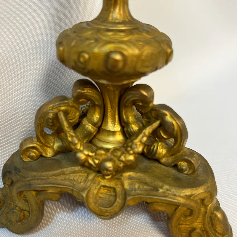 Gilt bronze lamp base and pair of black marble candlesticks, late 19th century