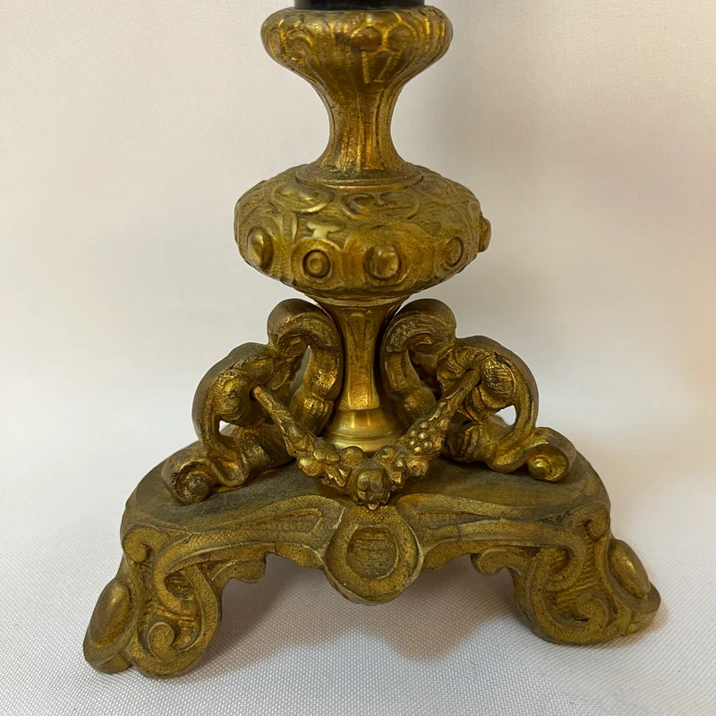 Gilt bronze lamp base and pair of black marble candlesticks, late 19th century
