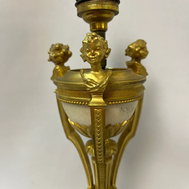 Gilt bronze lamp base and pair of black marble candlesticks, late 19th century