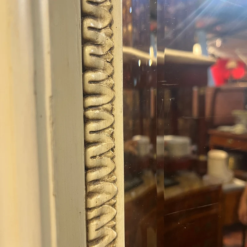 Italian beveled trumeau mirror with carved wood and cupids