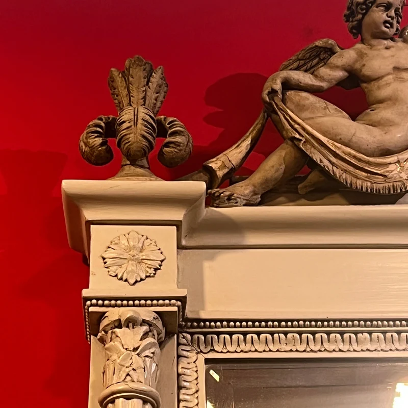 Italian beveled trumeau mirror with carved wood and cupids