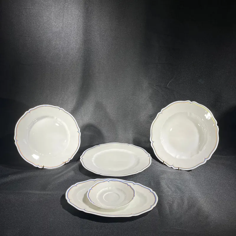 White Limoges Haviland French porcelain with blue rim and gold detail for 12 people