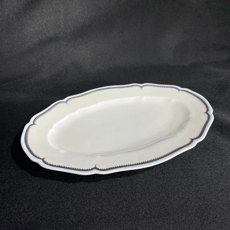 White Limoges Haviland French porcelain with blue rim and gold detail for 12 people