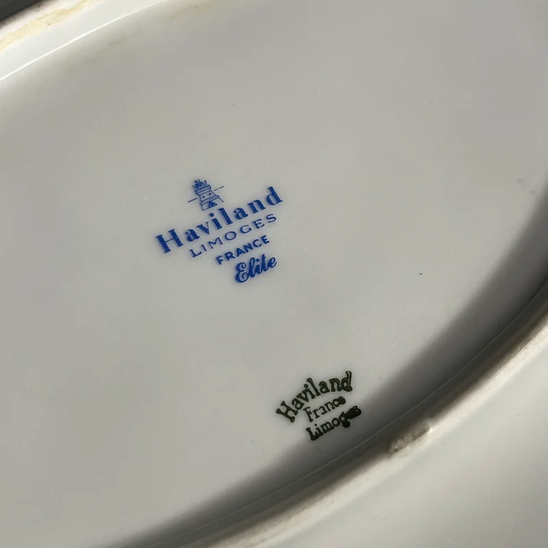 White Limoges Haviland French porcelain with blue rim and gold detail for 12 people