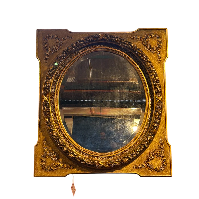 Oval mirror in the Louis XVI style with a gilt frame from the mid-20th century