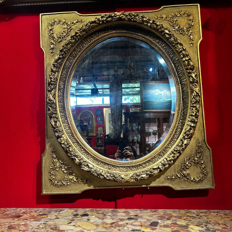 Oval mirror in the Louis XVI style with a gilt frame from the mid-20th century