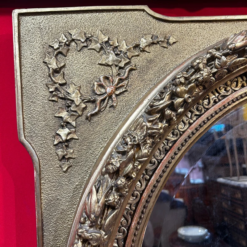 Oval mirror in the Louis XVI style with a gilt frame from the mid-20th century