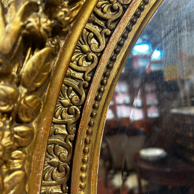 Oval mirror in the Louis XVI style with a gilt frame from the mid-20th century