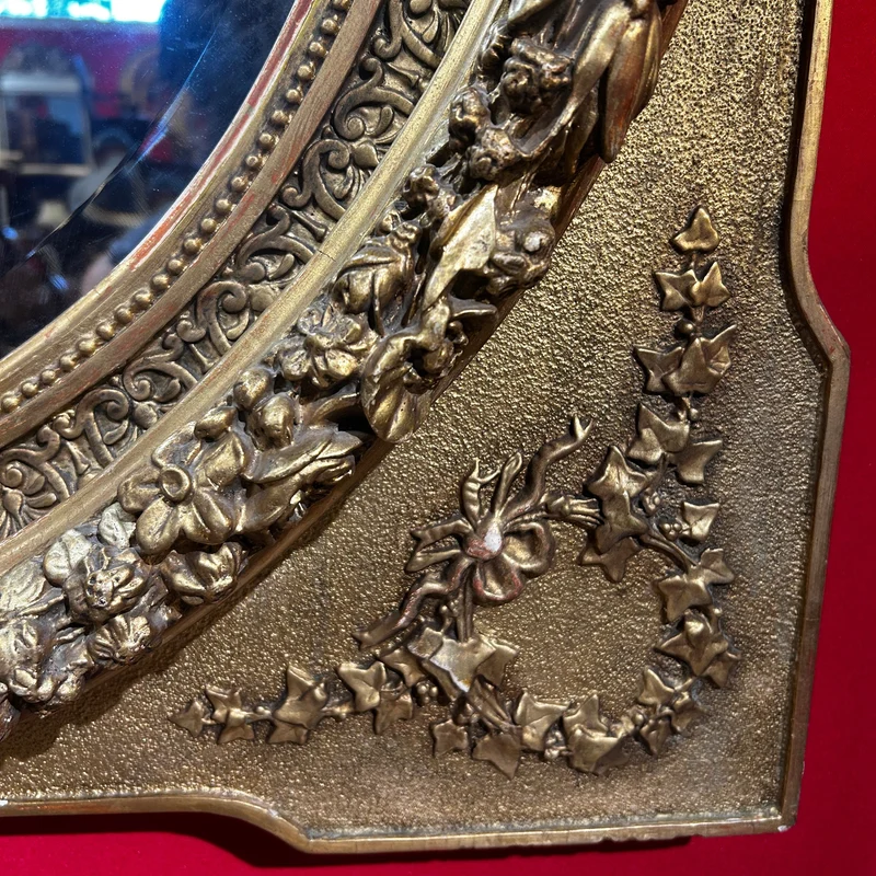 Oval mirror in the Louis XVI style with a gilt frame from the mid-20th century