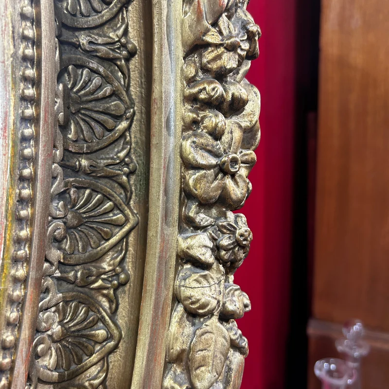 Oval mirror in the Louis XVI style with a gilt frame from the mid-20th century