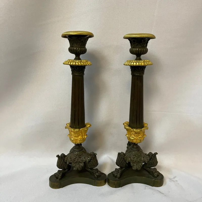 Pair of French tripod candlesticks in patinated and gilded bronze, Restoration style