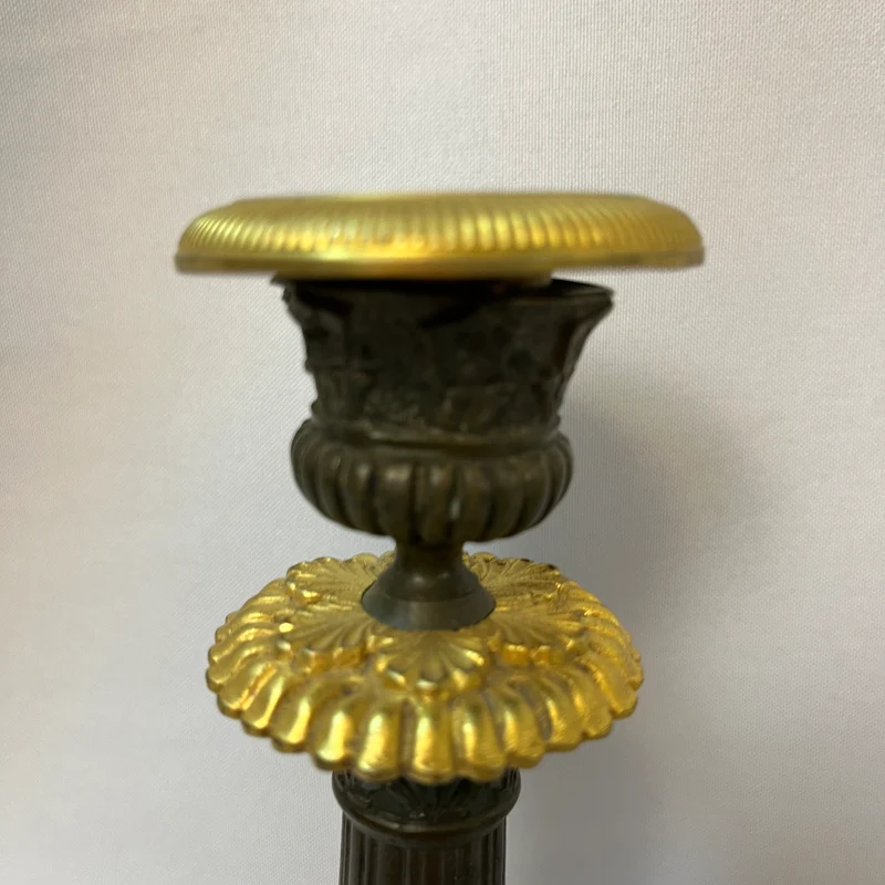 Pair of French tripod candlesticks in patinated and gilded bronze, Restoration style