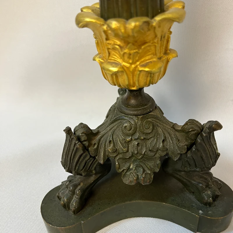 Pair of French tripod candlesticks in patinated and gilded bronze, Restoration style