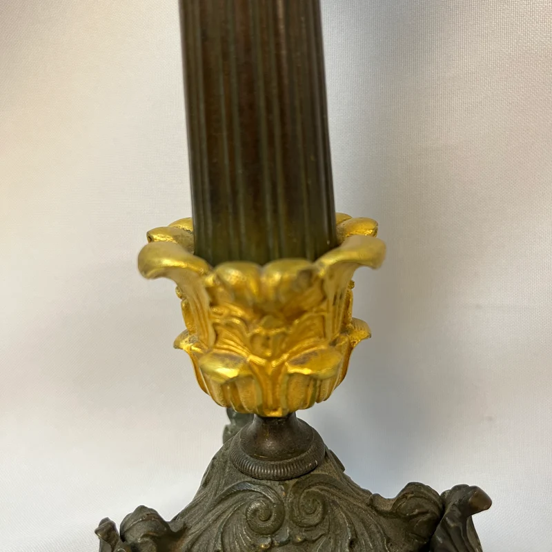 Pair of French tripod candlesticks in patinated and gilded bronze, Restoration style
