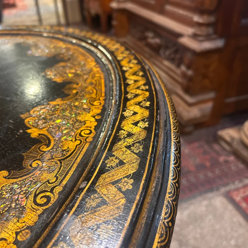 Napoleon III lacquered oval tripod gueridon with burgauté decoration and rose bouquet