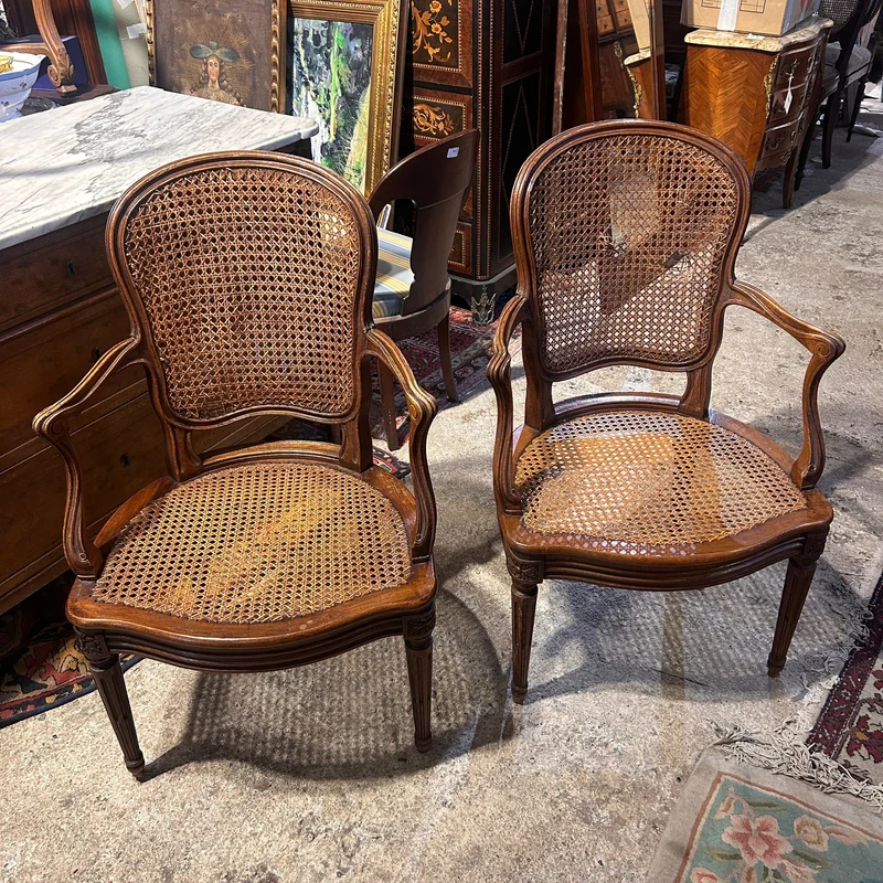 Pair of French caned armchairs in carved and molded wood, Louis XV style