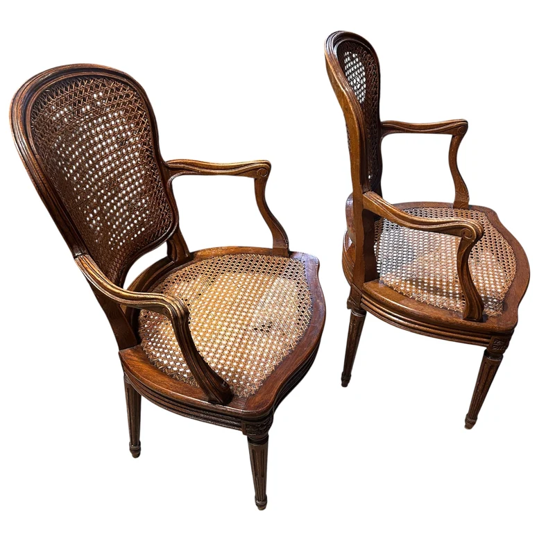 Pair of French caned armchairs in carved and molded wood, Louis XV style