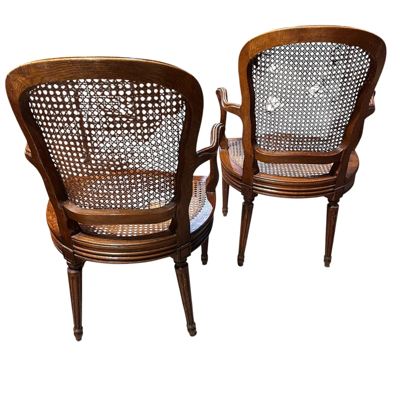 Pair of French caned armchairs in carved and molded wood, Louis XV style