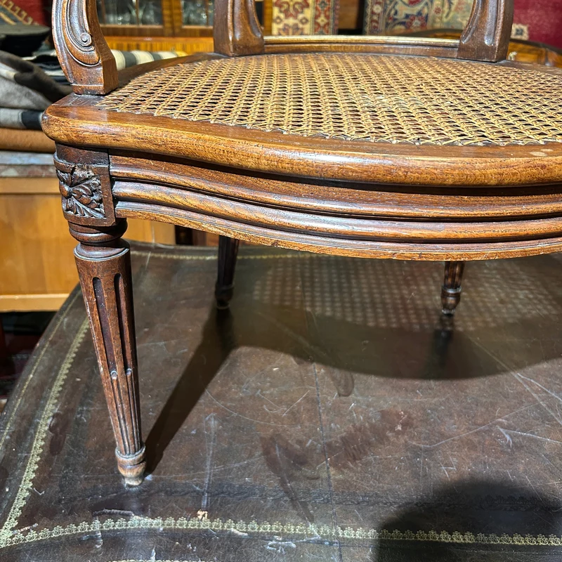 Pair of French caned armchairs in carved and molded wood, Louis XV style