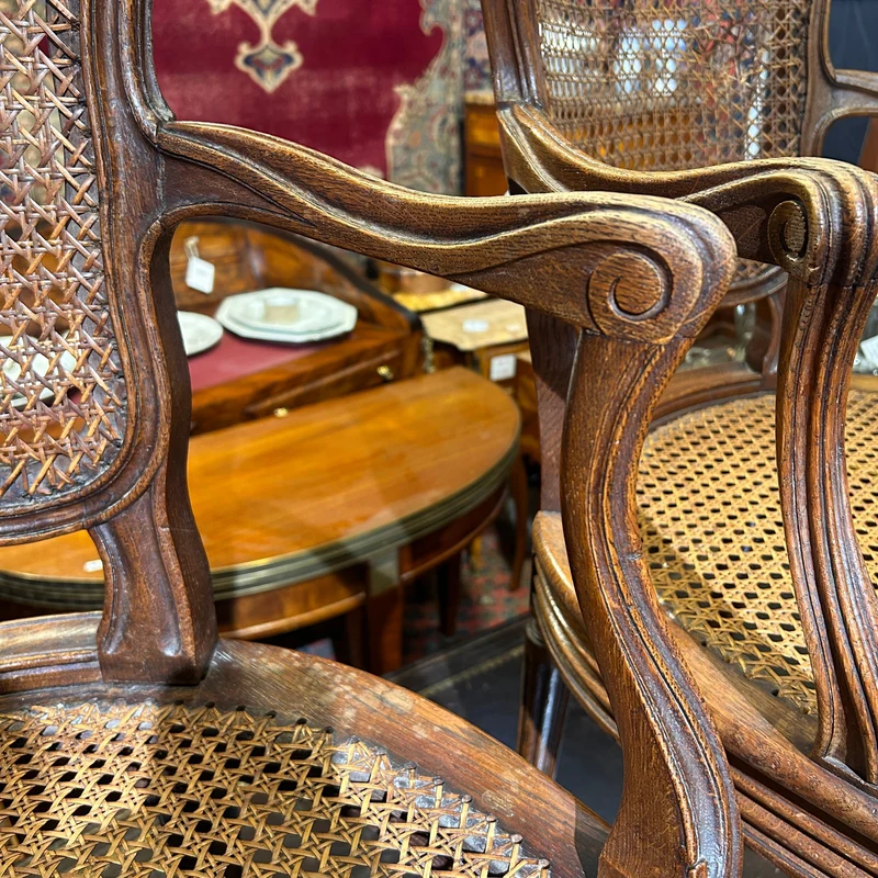 Pair of French caned armchairs in carved and molded wood, Louis XV style