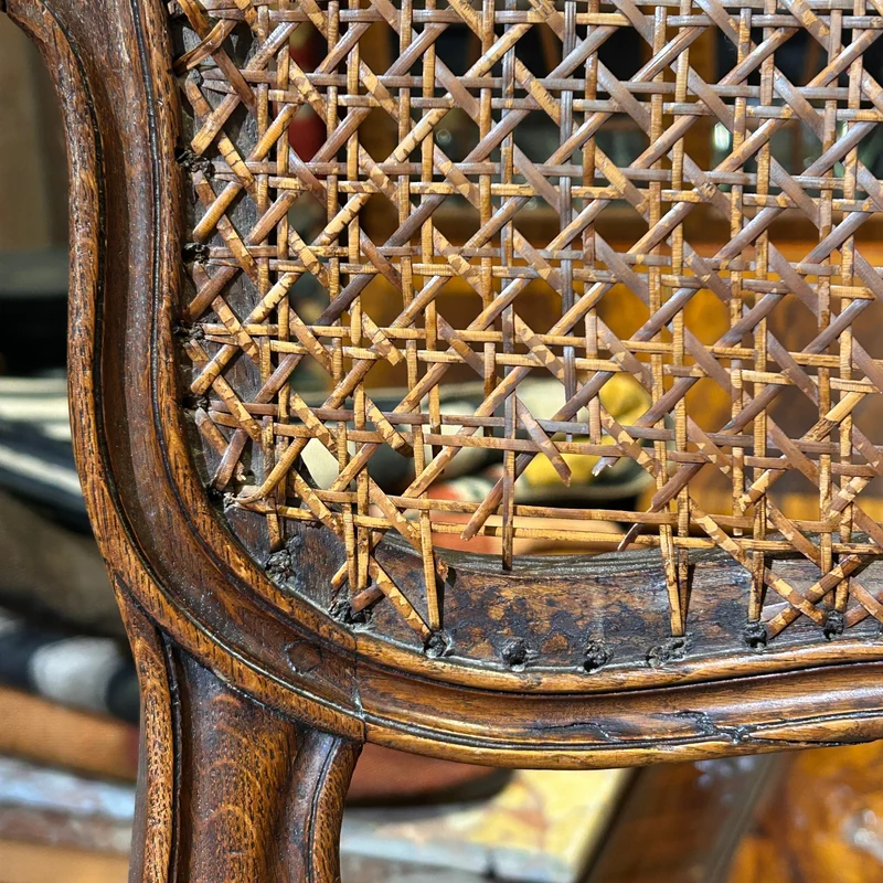 Pair of French caned armchairs in carved and molded wood, Louis XV style