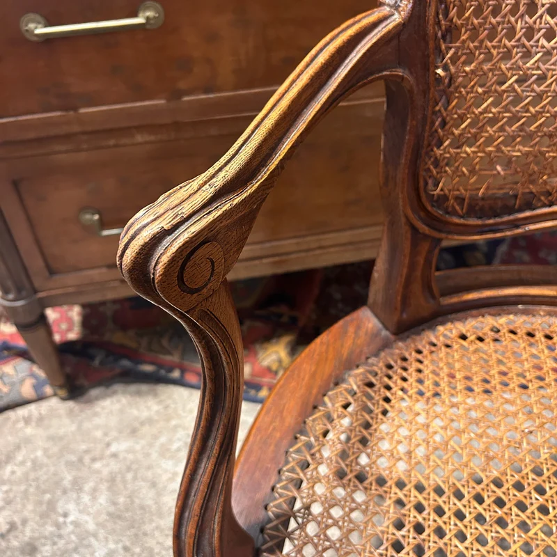 Pair of French caned armchairs in carved and molded wood, Louis XV style