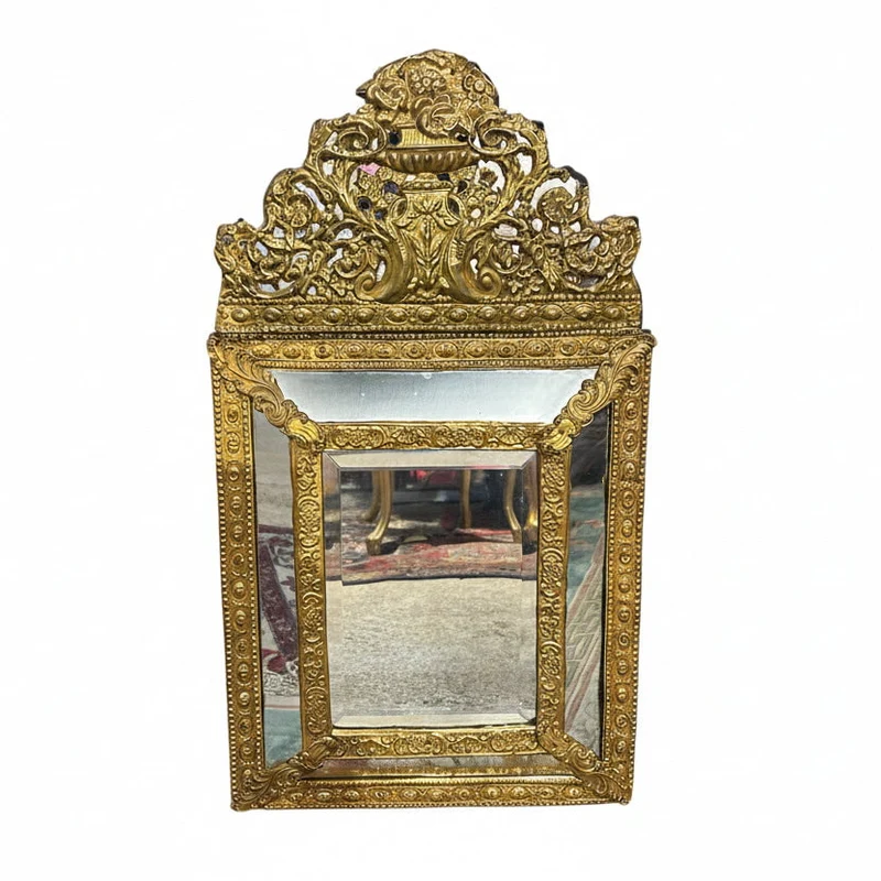 Louis XIV style mirror. Embossed brass and double bevel.