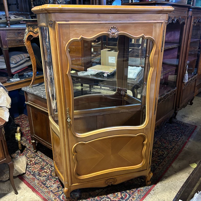 Contemporary French Louis XV bombé display cabinet with carved wood and interior mirror
