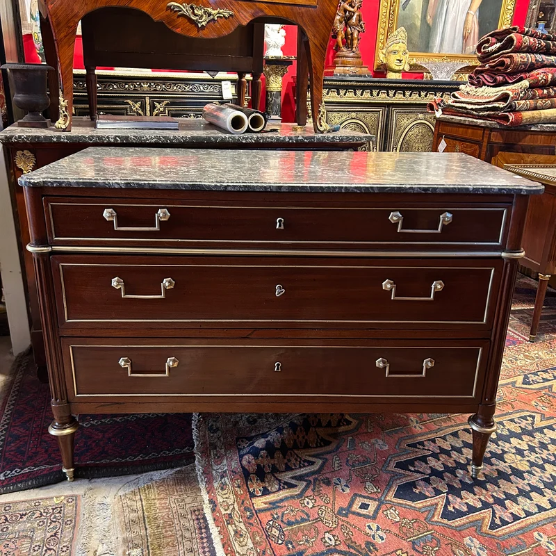 Mahogany chest of drawers with marble top in late Louis XVI style