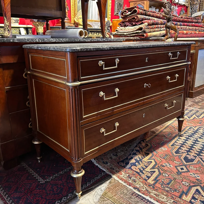 Mahogany chest of drawers with marble top in late Louis XVI style