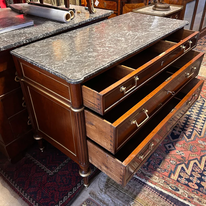 Mahogany chest of drawers with marble top in late Louis XVI style