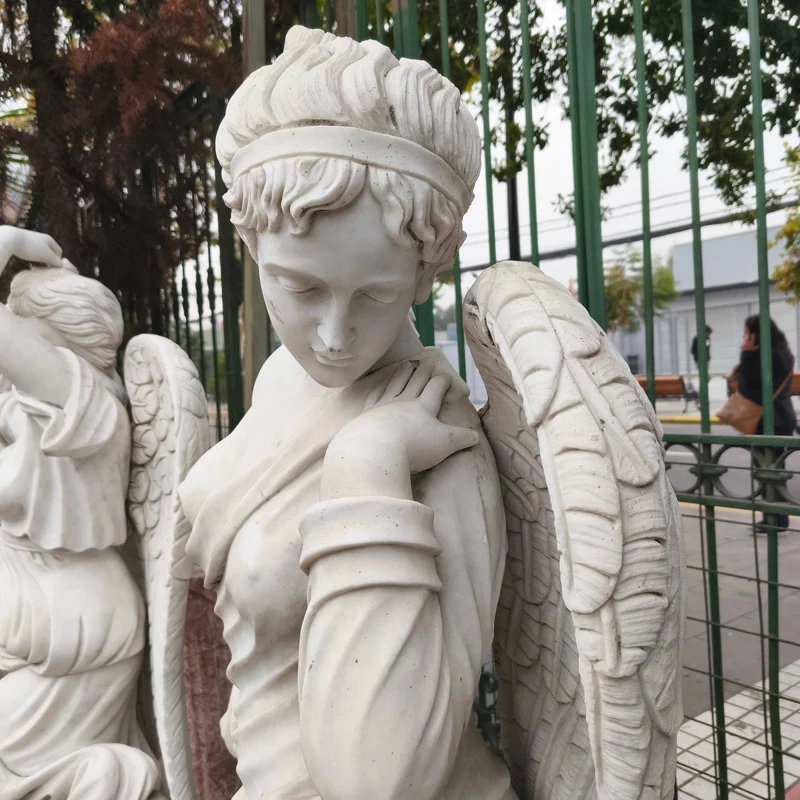 Angel of the Four Seasons - Winter sculpture in carved marble stone