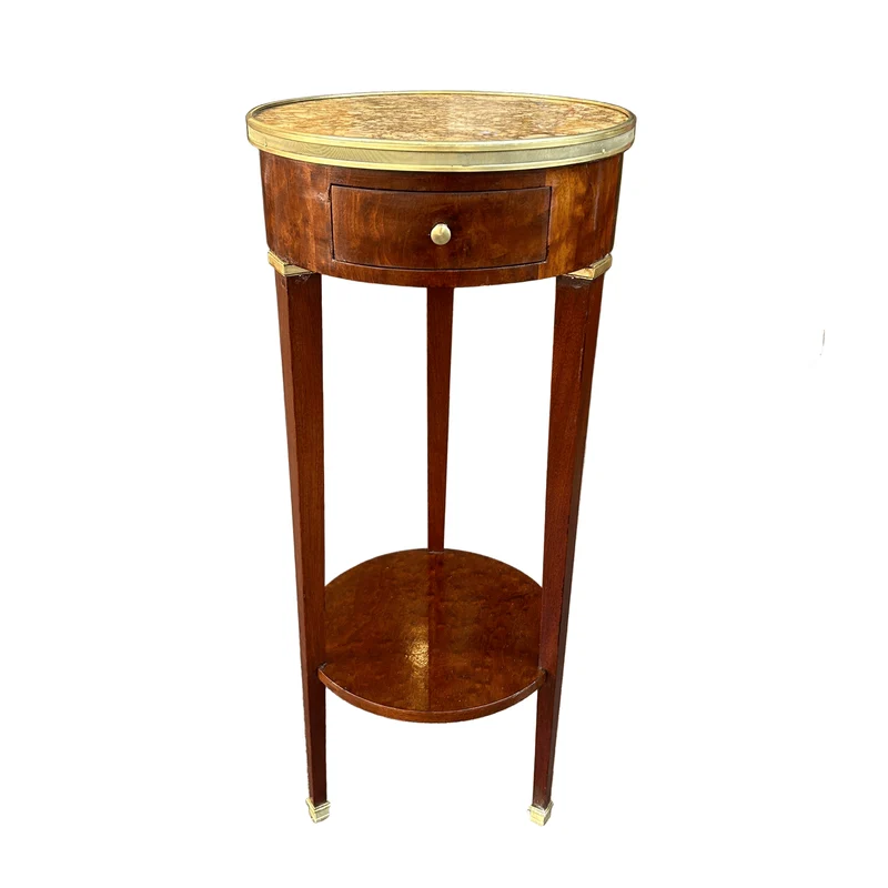 French circular side table covered in marble, Louis XVI style