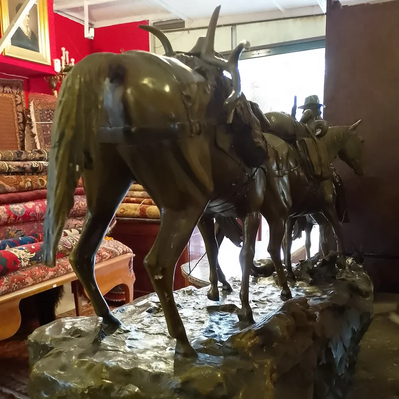Bronze sculpture by R. Clark 'Cowboy and Horses Crossing the Mountain'