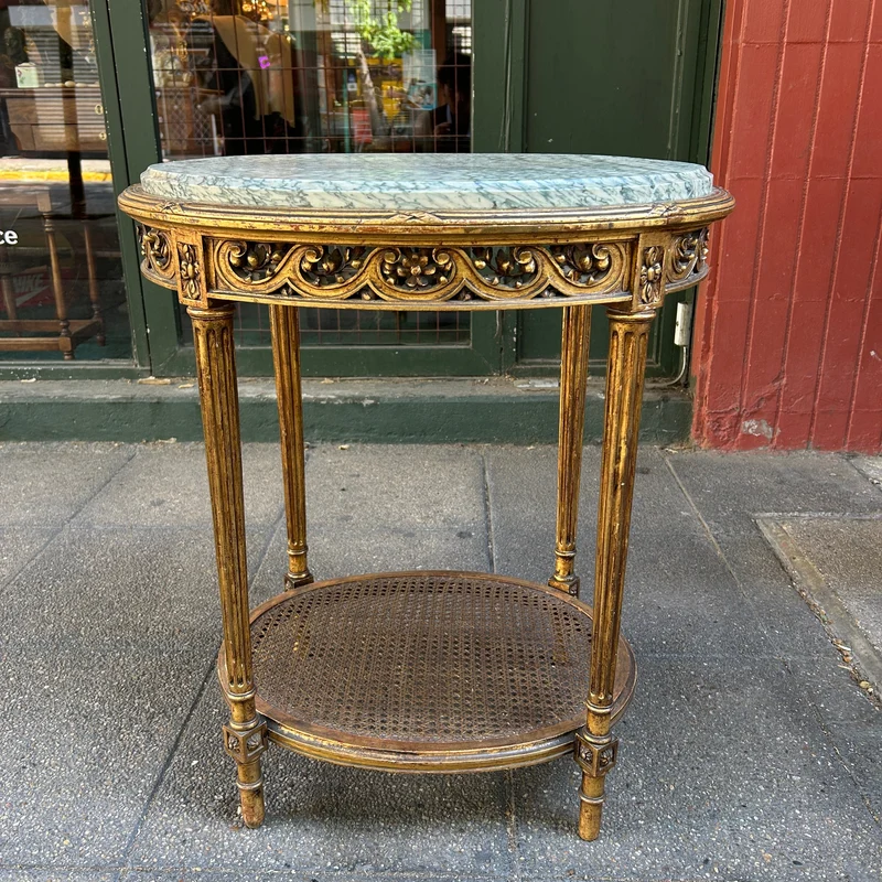 French Louis XVI side table carved in gilt reed and topped with veined green marble