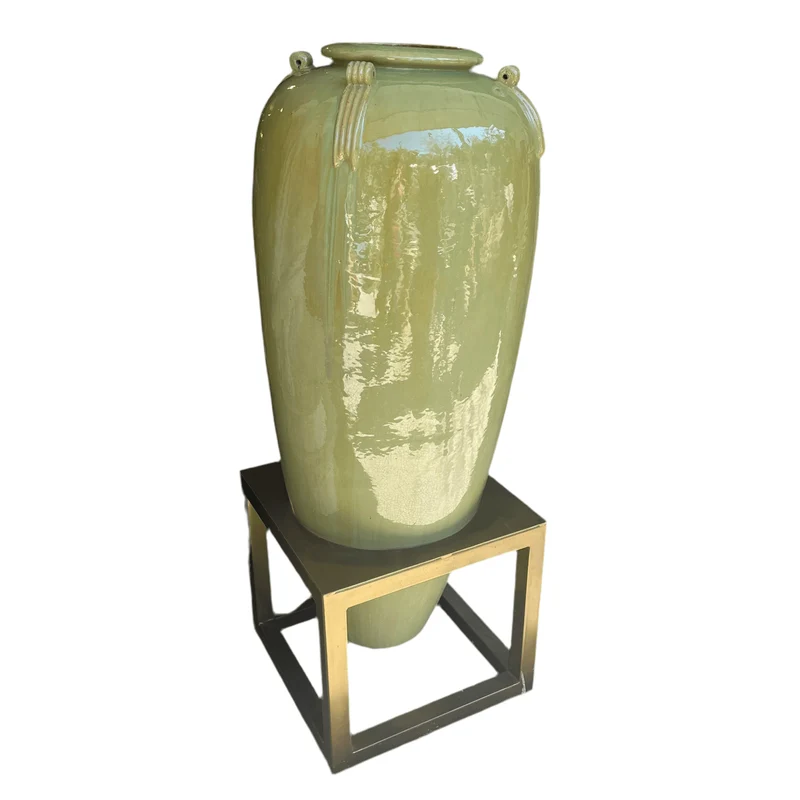 Large Chinese vase of green glazed ceramic on a metal base