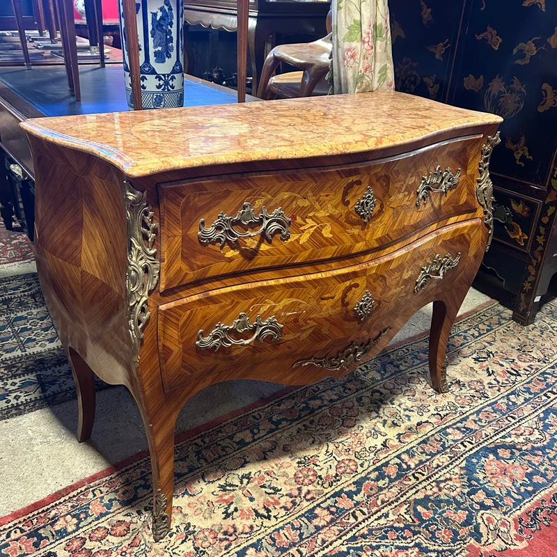 Louis XV style chest of drawers in orange-toned marble with marquetry