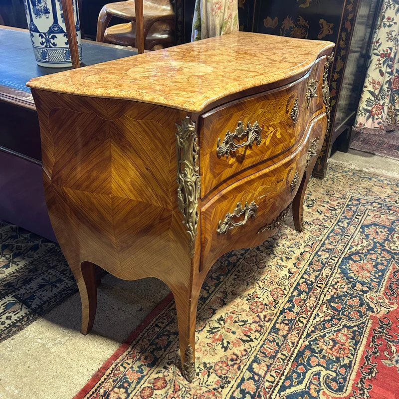 Louis XV style chest of drawers in orange-toned marble with marquetry