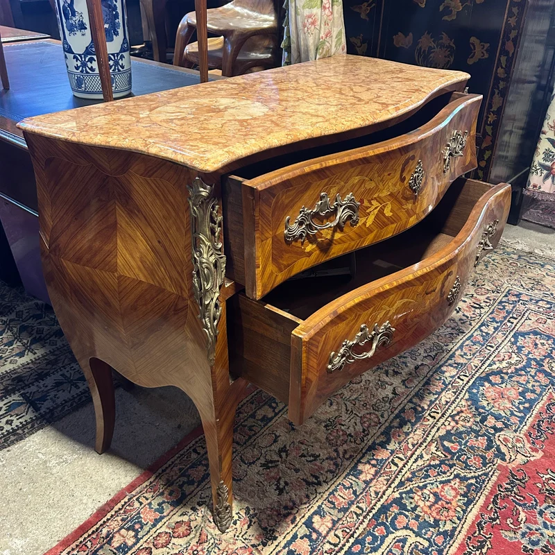 Louis XV style chest of drawers in orange-toned marble with marquetry