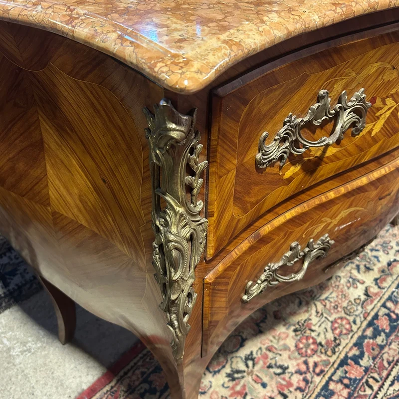 Louis XV style chest of drawers in orange-toned marble with marquetry