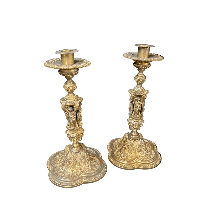 Pair of Russian bronze candlesticks with figures and reliefs