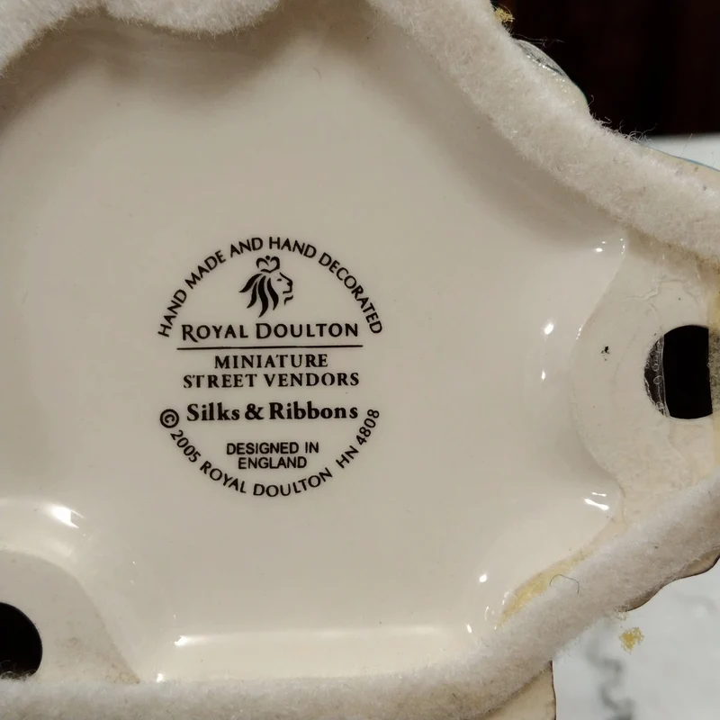 Royal Doulton 'Silks and Ribbons' porcelain figurine, 2005 miniature edition